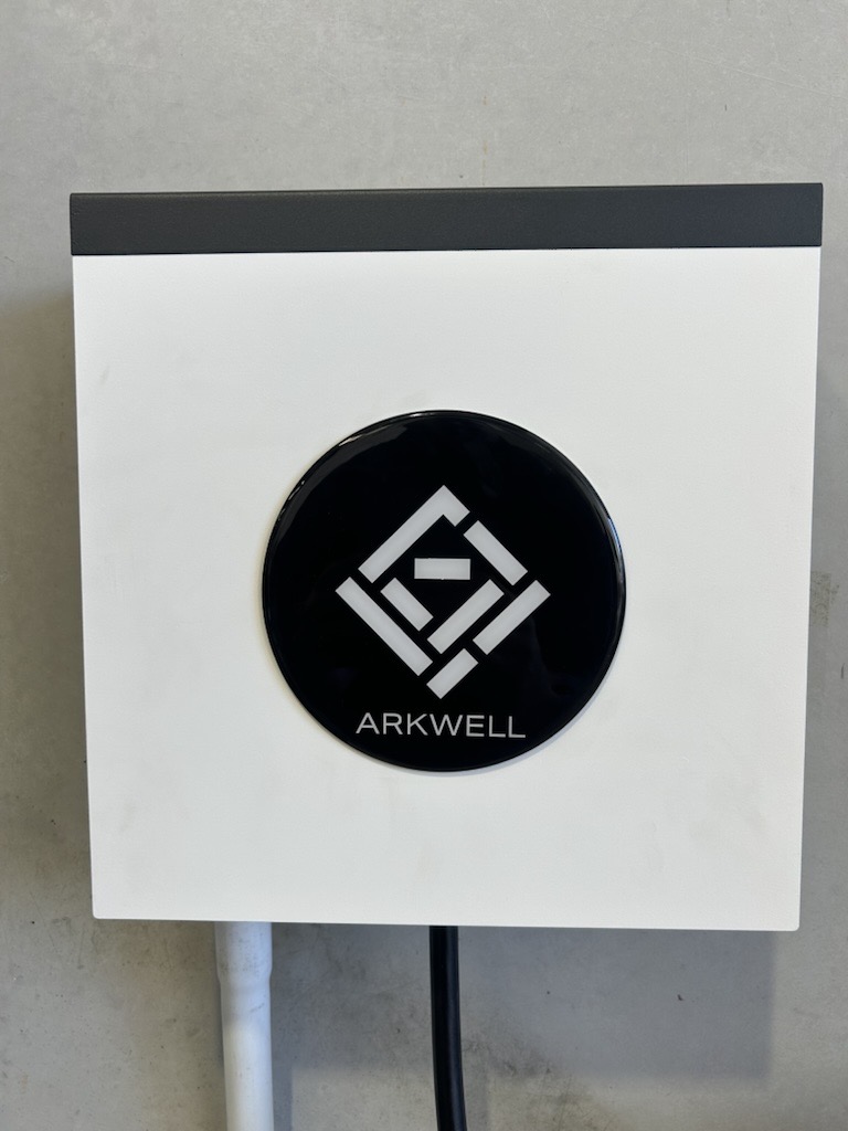 An Arkwell-branded EV charger mounted at a venue
